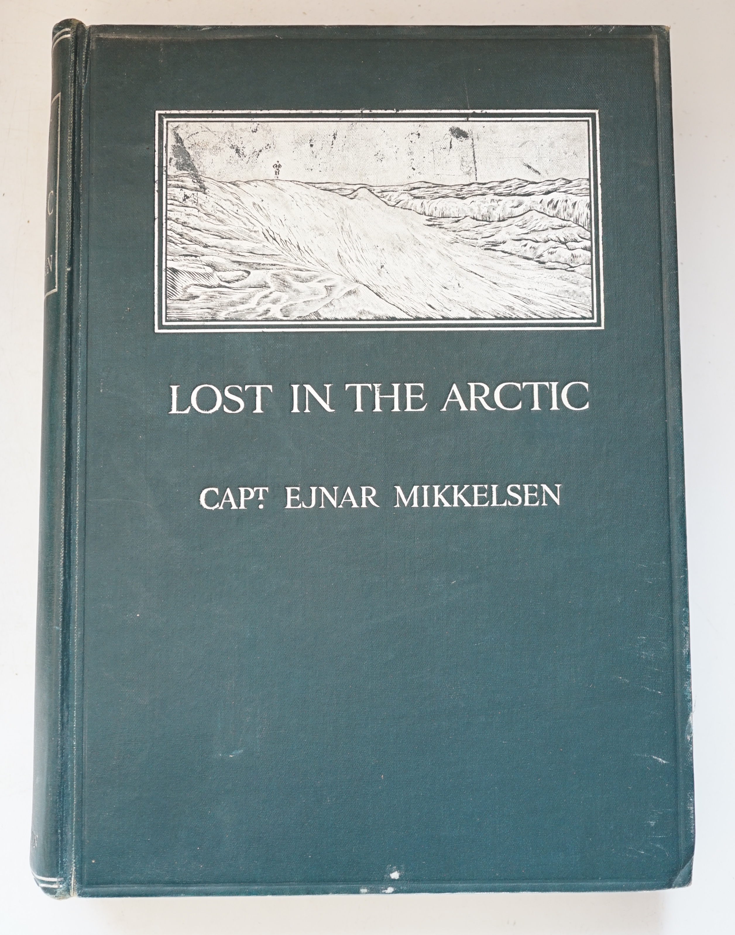 Mikkelsen, Ejnar. Lost in the Arctic being the Story of the 'Alabama' Expedition, 1909-1912, 1st edition, illustrated, including folding map at rear, 4to, cloth, pictorial decorated in silver with a panel depicting an ic